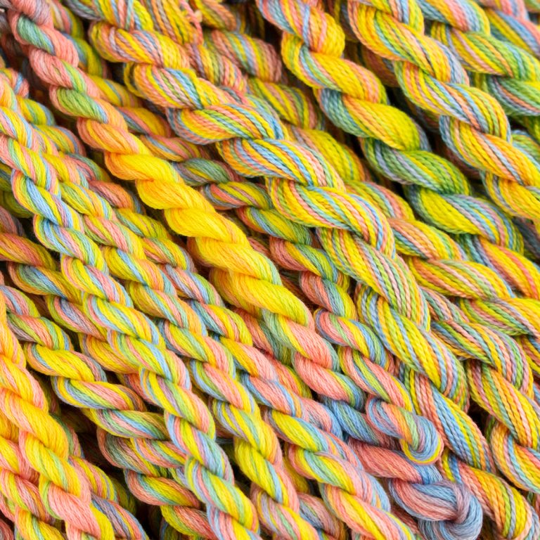 Colour Complements hand dyed embroidery thread. Colour 23 is a blend of yellow, blue, and pink for Easter