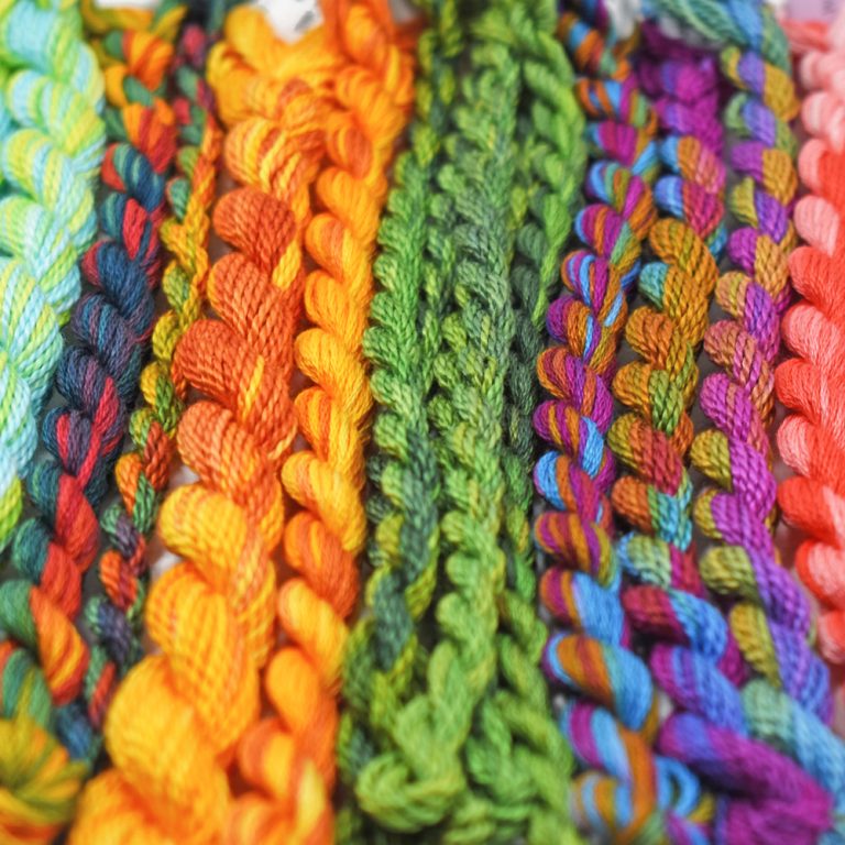 Colorful hand dyed floss skeins, ideal for Canadian crafters.