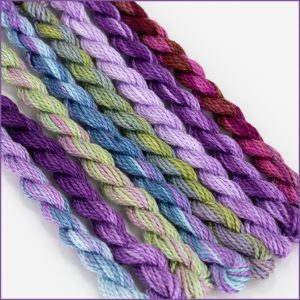 Size 3 Perle Cotton Sampler in shades of purple, blue, and green.