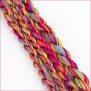 variegated perle cotton thread, color #110, in vibrant pink, orange, yellow, and blue hues.