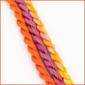 Colorful cotton embroidery floss sampler with shades of orange, pink, and yellow