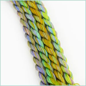 cotton floss in shades of green, yellow, and purple
