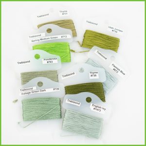 Trebizond Silk embroidery threads in various shades of green, labeled with names and numbers.