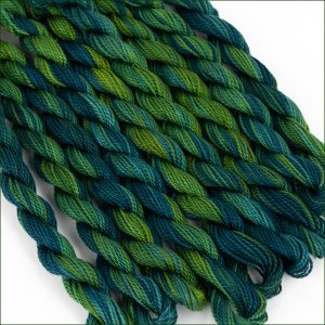 variegated green and teal size 5 perle cotton threads.